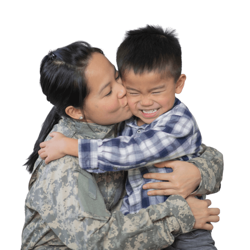 woman in military clothing kissing son on cheek